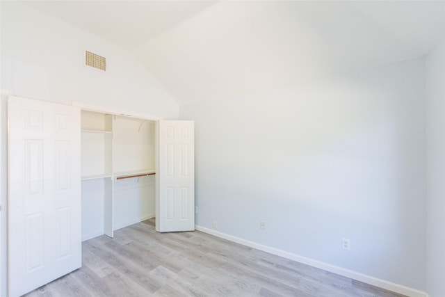 7404 Maybrook Ct, Plano, TX 75024 - unfurnished bedroom featuring vaulted ceiling, light wood-type flooring, a closet, and baseboards