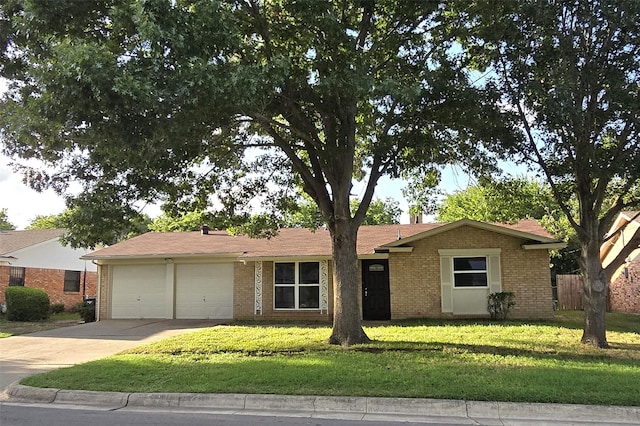 ranch-style house featuring a front lawn, brick siding, concrete driveway, an attached garage, and fence
