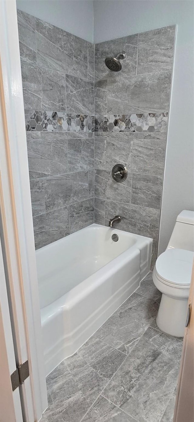 full bathroom with toilet and shower / bathing tub combination