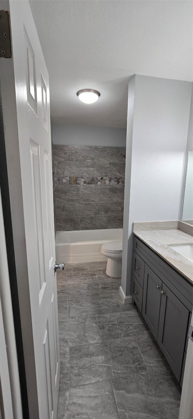 full bath with vanity, toilet, and tub / shower combination