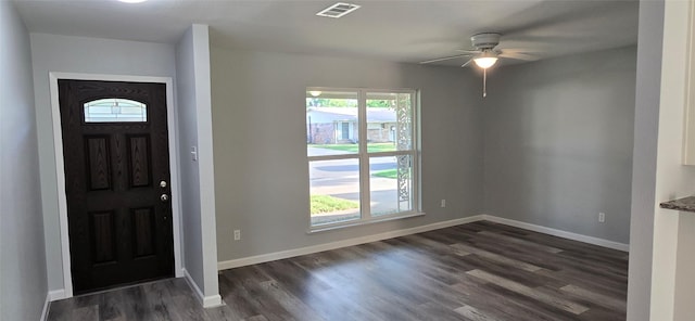 foyer featuring dark wood finished floors, visible vents, a ceiling fan, and baseboards