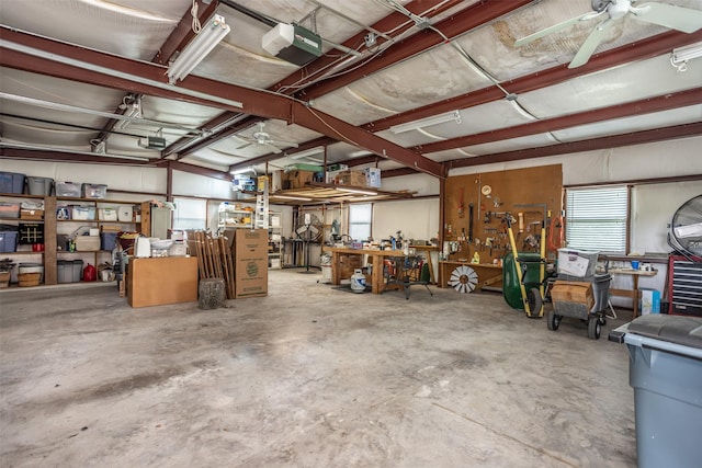 garage with a workshop area, ceiling fan, and a garage door opener