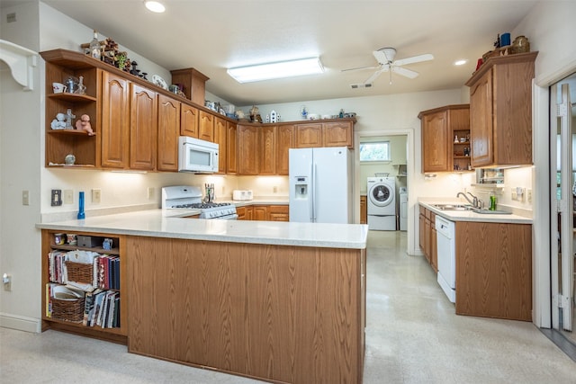 kitchen with open shelves, washer / clothes dryer, ceiling fan, white appliances, and a peninsula
