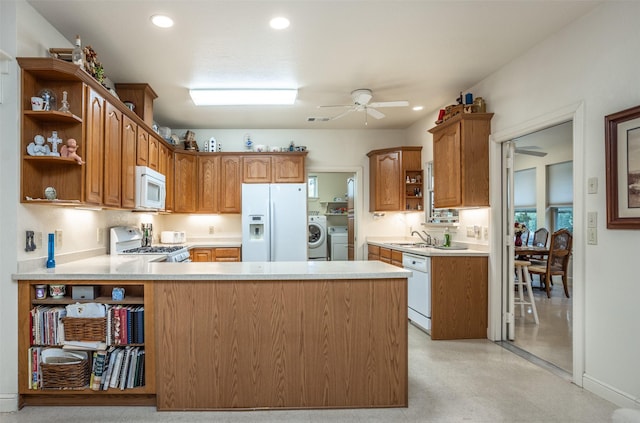 kitchen with a ceiling fan, a sink, open shelves, and white appliances