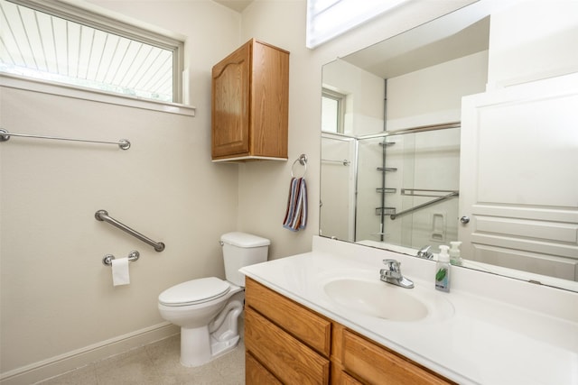 full bathroom featuring baseboards, a shower stall, toilet, and vanity