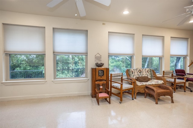 living area with ceiling fan, recessed lighting, and baseboards
