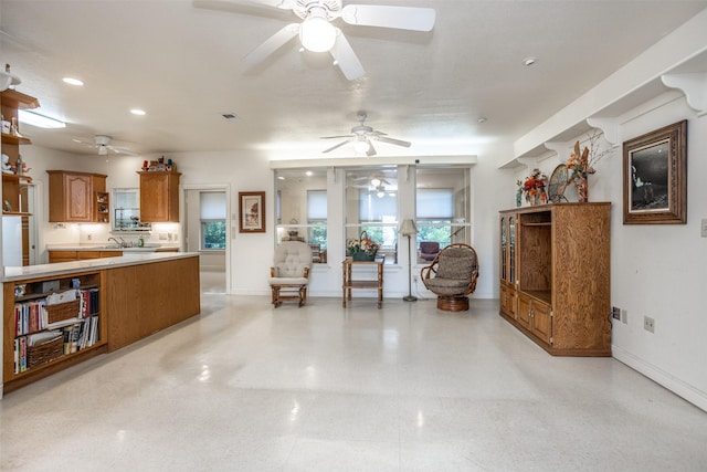 living area featuring recessed lighting, ceiling fan, baseboards, and visible vents
