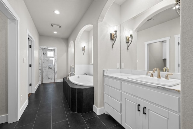 727 S Sugartree Dr, Lipan, TX 76462 - bathroom with visible vents, recessed lighting, tile patterned floors, a garden tub, and vanity