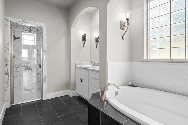727 S Sugartree Dr, Lipan, TX 76462 - bathroom with a marble finish shower, tile patterned flooring, a bath, and vanity