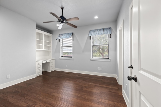 727 S Sugartree Dr, Lipan, TX 76462 - unfurnished bedroom with built in desk, dark wood-style floors, recessed lighting, a ceiling fan, and baseboards