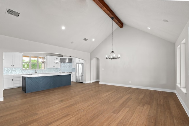 727 S Sugartree Dr, Lipan, TX 76462 - unfurnished living room with beamed ceiling, a notable chandelier, high vaulted ceiling, visible vents, and wood finished floors