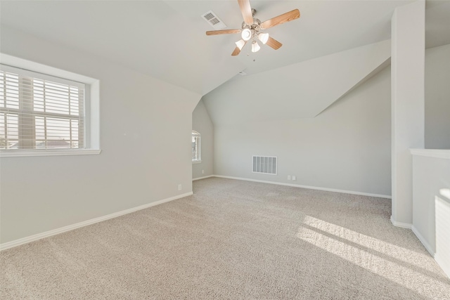 bonus room featuring visible vents, ceiling fan, carpet floors, and plenty of natural light