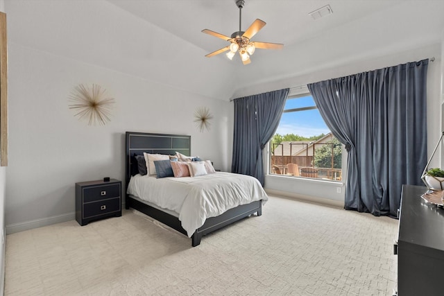 bedroom featuring carpet floors, ceiling fan, baseboards, visible vents, and lofted ceiling