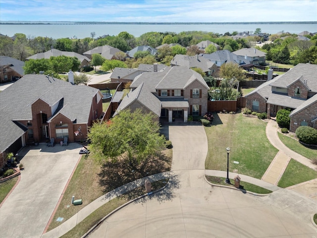 aerial view with a residential view and a water view