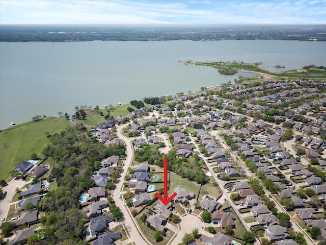 aerial view featuring a residential view and a water view