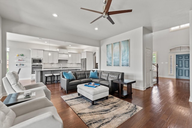 living room with recessed lighting, ceiling fan, dark wood-style flooring, and baseboards