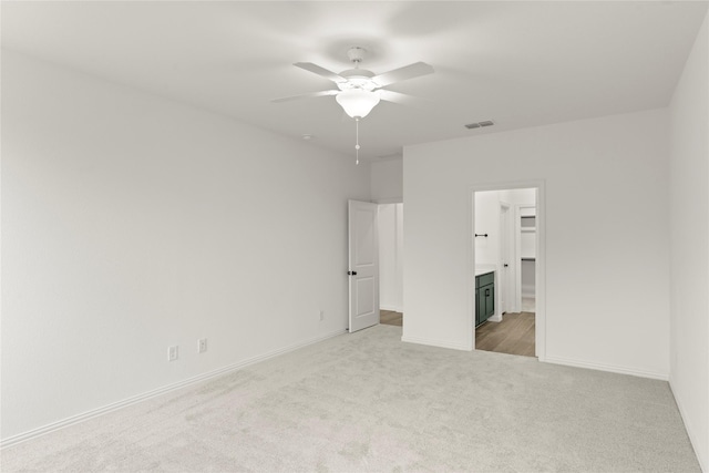 802 Roanoke, Princeton, TX 75407 - unfurnished bedroom featuring light colored carpet, ensuite bath, baseboards, and ceiling fan