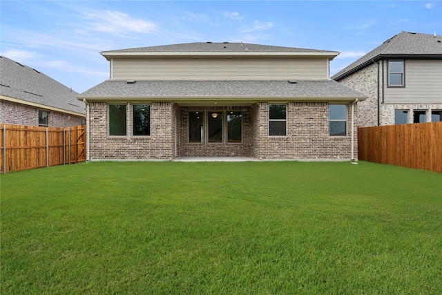 802 Roanoke, Princeton, TX 75407 - back of house featuring brick siding and roof with shingles