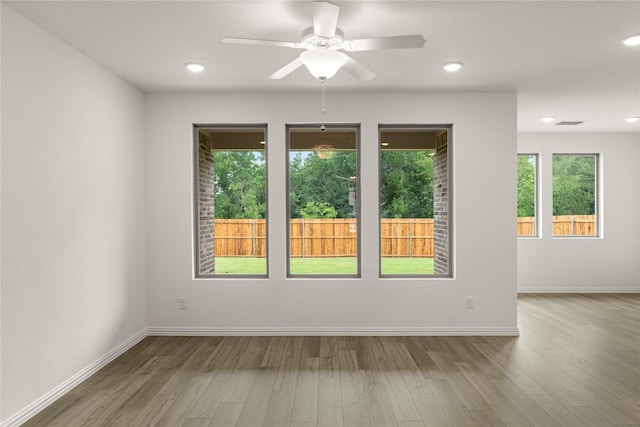 802 Roanoke, Princeton, TX 75407 - empty room with wood finished floors, a ceiling fan, baseboards, and recessed lighting