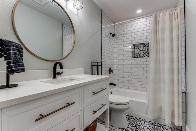 bathroom featuring recessed lighting, tile patterned floors, toilet, vanity, and shower / tub combo with curtain