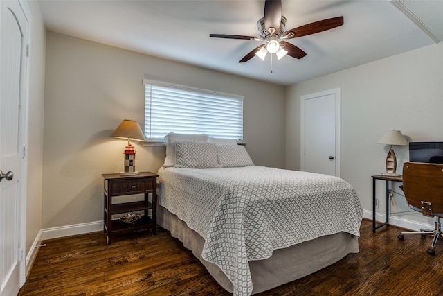 bedroom featuring a ceiling fan, wood finished floors, and baseboards