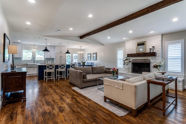 living room featuring recessed lighting, vaulted ceiling with beams, a fireplace, dark wood-style floors, and visible vents