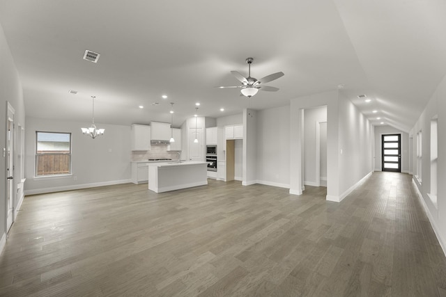 2612 Chester Dr, Celina, TX 75009 - unfurnished living room with a ceiling fan, baseboards, a chandelier, recessed lighting, and light wood-type flooring