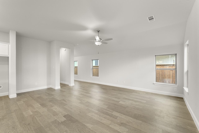 2612 Chester Dr, Celina, TX 75009 - unfurnished living room with a ceiling fan, plenty of natural light, and light wood-style flooring