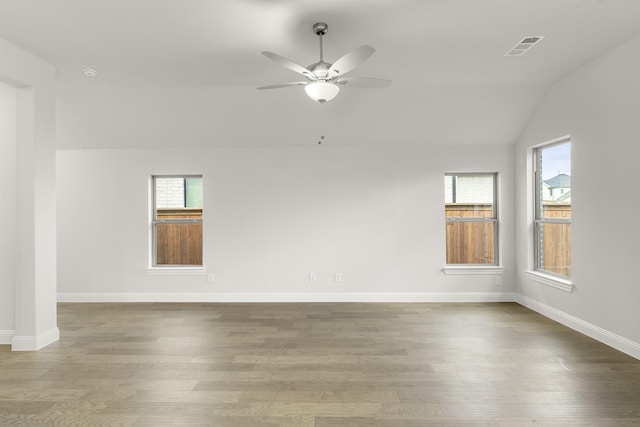 2612 Chester Dr, Celina, TX 75009 - empty room with wood finished floors, plenty of natural light, a ceiling fan, and vaulted ceiling