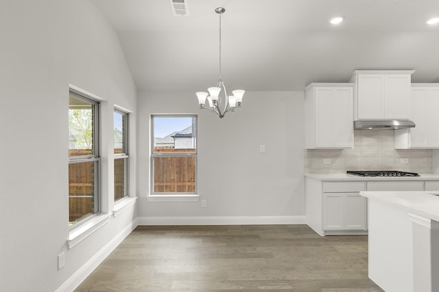 2612 Chester Dr, Celina, TX 75009 - unfurnished dining area featuring vaulted ceiling, light wood finished floors, recessed lighting, a chandelier, and baseboards
