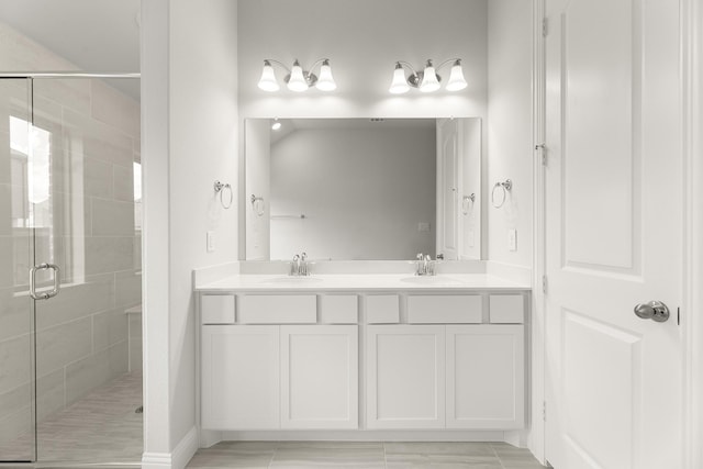 2612 Chester Dr, Celina, TX 75009 - full bathroom featuring a stall shower, double vanity, and baseboards