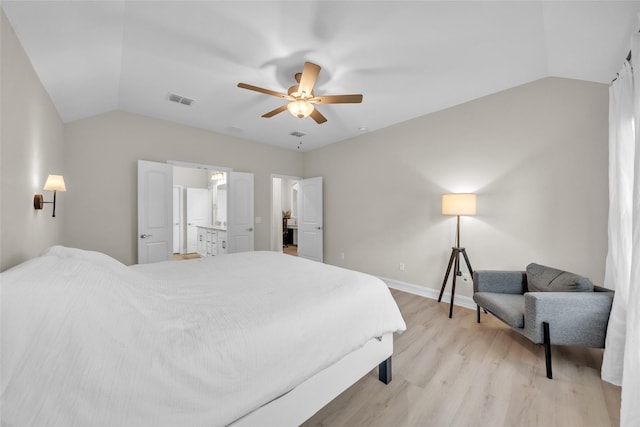 bedroom featuring light wood finished floors, ceiling fan, visible vents, baseboards, and lofted ceiling