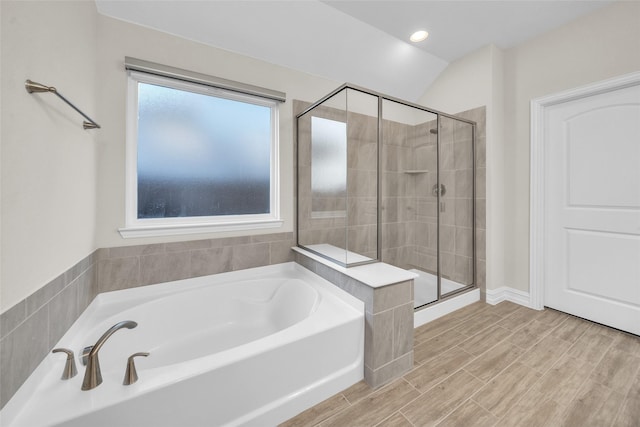 full bathroom featuring a bath, recessed lighting, and a shower stall
