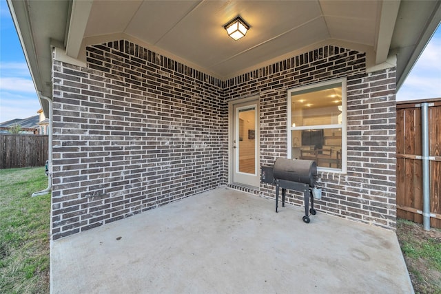 view of patio with fence and grilling area