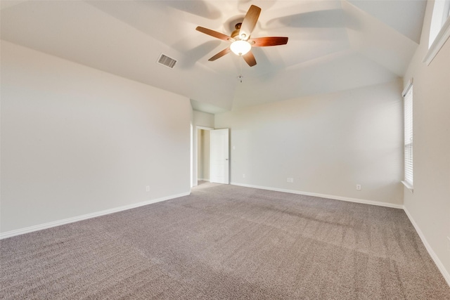 unfurnished room with a ceiling fan, visible vents, carpet, and baseboards