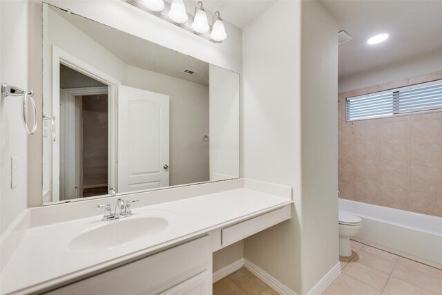 bathroom with toilet, tile patterned floors, visible vents, and vanity