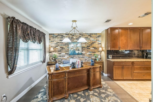 dining area with arched walkways, a ceiling fan, baseboards, wood finished floors, and ornamental molding