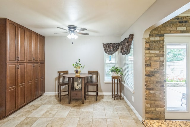 living room featuring arched walkways, a ceiling fan, recessed lighting, and wood finished floors