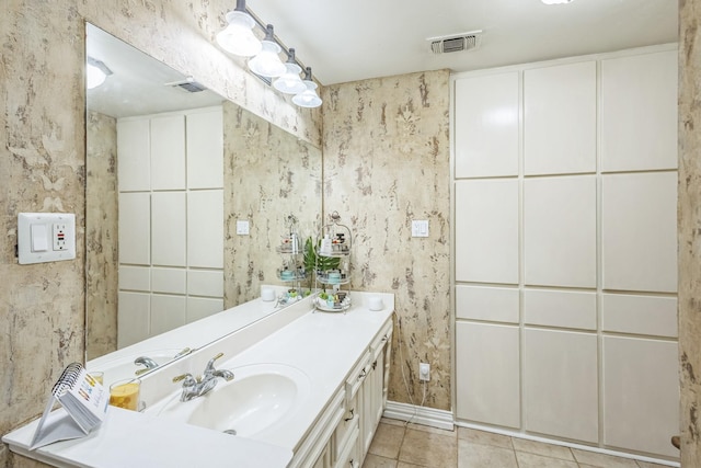 full bathroom featuring vanity, tile patterned floors, and a stall shower