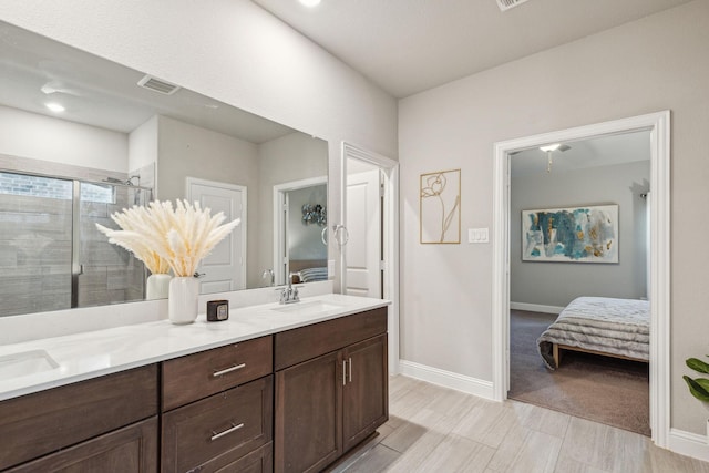 2129 Gill Star Dr, Haslet, TX 76052 - bathroom featuring ensuite bathroom, a stall shower, baseboards, and double vanity