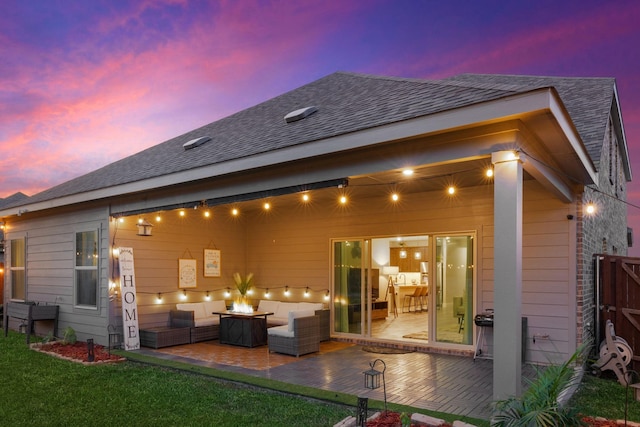 2129 Gill Star Dr, Haslet, TX 76052 - back of property at dusk featuring an outdoor living space with a fire pit, a patio area, and roof with shingles