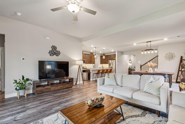 2129 Gill Star Dr, Haslet, TX 76052 - living room with wood finished floors, recessed lighting, a ceiling fan, baseboards, and stairway