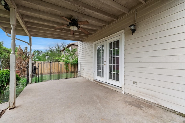 view of patio featuring ceiling fan, fence, and french doors