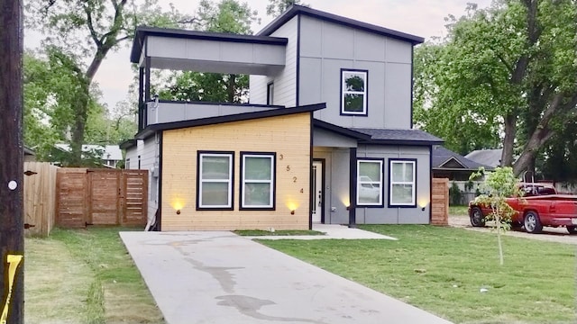 3524 Carl St, Dallas, TX 75210 - contemporary home with fence, concrete driveway, and a front yard