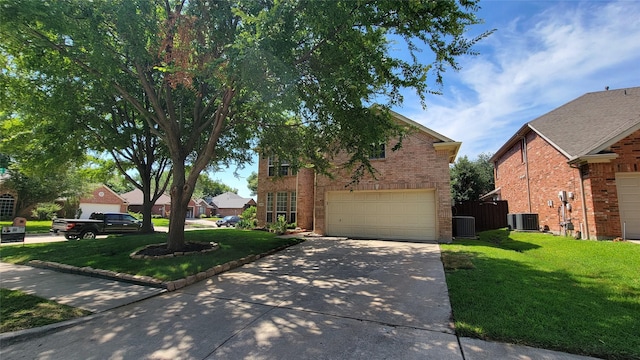 12165 Shoal Creek Dr, Frisco, TX 75035 - traditional home featuring driveway, brick siding, a front lawn, and central air condition unit