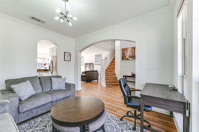 12165 Shoal Creek Dr, Frisco, TX 75035 - office with arched walkways, crown molding, light wood-style flooring, a chandelier, and baseboards