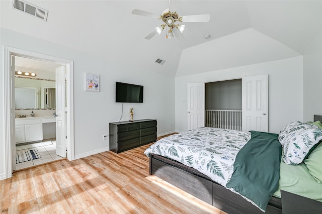 12165 Shoal Creek Dr, Frisco, TX 75035 - bedroom with light wood-style flooring, lofted ceiling, baseboards, ceiling fan, and ensuite bath