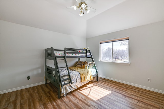 12165 Shoal Creek Dr, Frisco, TX 75035 - bedroom with baseboards, wood finished floors, vaulted ceiling, and a ceiling fan