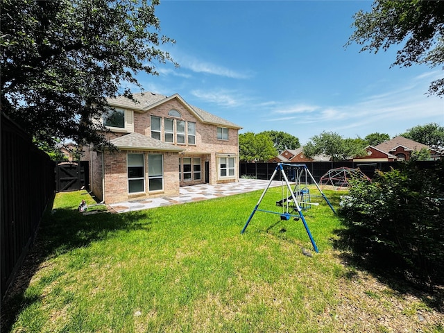 12165 Shoal Creek Dr, Frisco, TX 75035 - rear view of property with a patio area, a playground, brick siding, and roof with shingles