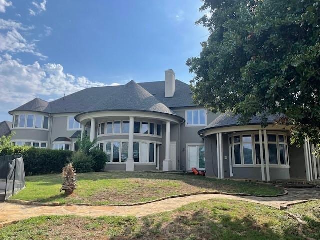 1900 Durance Ct, Corinth, TX 76210 - back of house featuring a lawn, stucco siding, and a chimney